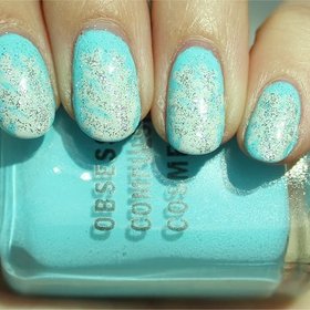 Snowflake Nails
Nail tutorial & more photos here: http://www.swatchandlearn.com/nail-art-tutorial-snowflake-nails/