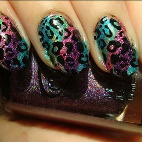 Holographic Rainbow Leopard Nails
Nail tutorial & more photos here: http://www.swatchandlearn.com/nail-art-tutorial-holographic-rainbow-leopard-konadicure/