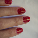 Revlon Colorstay nail enamel in 120 red carpet with China Glaze nail lacquer with hardeners in 551 fairy dust.