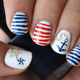 White base. Stripes done with acrylic paints.

http://iloveprettycolours.blogspot.com/2012/05/nautical-nails-getting-ready-for-summer.html