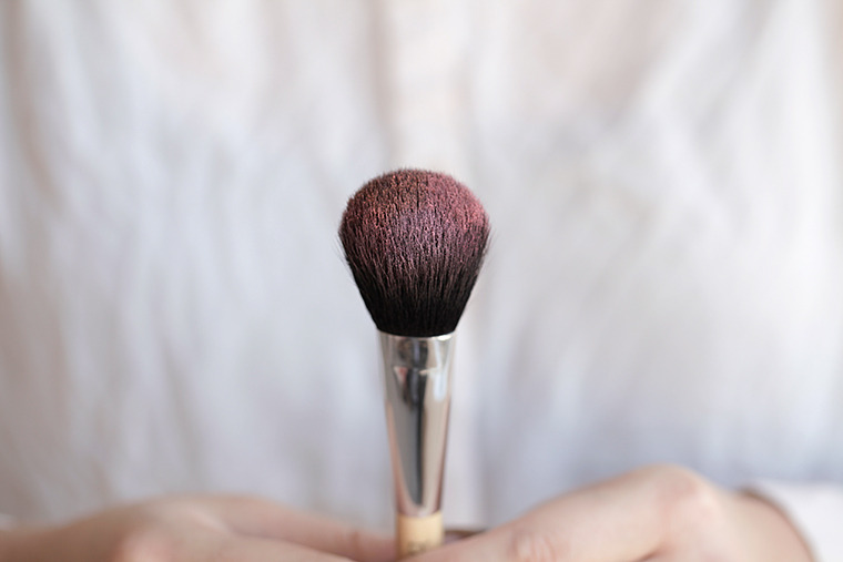 Cleaning powder makeup brushes is best with spray