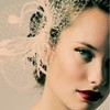 This gorgeous white fascinator pairs perfectly with pale, glowing skin and ruby-stained lips. {via pinterest}