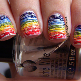 http://thepolishwell.blogspot.com/2012/05/nail-ideas-rainbow-stripes.html

For those who are interested, here's a video tutorial - http://www.beautylish.com/v/rrvuir/rainbow-stripes-tutorial