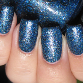 OPI Absolutely Alice and Nicole by OPI Pitch Black Glimmer sunlight, with topcoat