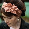 The ruffled peach satin headband pairs perfectly with a pouffed updo and classic styling. Trés chic! {via pinterest}