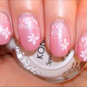 Flowers & Lace Nails
More photos here: http://www.swatchandlearn.com/nail-art-pink-valentines-day-konadicure-using-konad-image-plate-m57/