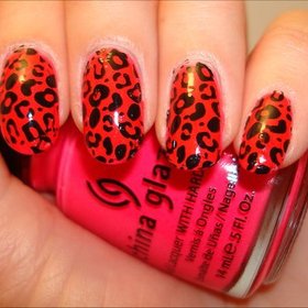Neon Pink & Black Leopard Nails
More photos here: http://www.swatchandlearn.com/nail-art-neon-pink-black-leopard-manicure-using-the-konad-m57-image-plate-konad-nail-art-swatches/