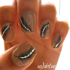 Tutorial here: http://www.beautylish.com/v/rrvmyw/sparkling-feather-nails