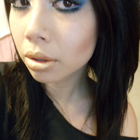 blue sultry eyes with gold lips 