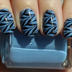 Black & Blue Konadicure
See more photos here: http://www.swatchandlearn.com/nail-art-black-blue-konadicure-using-essie-lapis-of-luxury-konad-image-plate-m78/