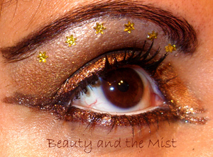 An eye makeup with gold colours