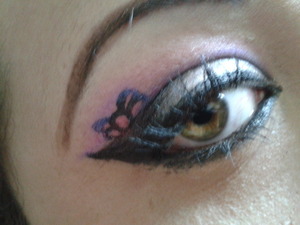 defined eye shadow with bow drawn with eyeliner on crease 