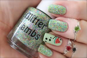 Glitter Lambs "Ant Picnic" glitter topper nail polish looks just like a PICNIC on the nails! This is worn by @LacqueredLori and the accent nail has a cute watermelon slice.

Ant Picnic Glitter Topper Nail Polish is a clear base filled with Neon Yellow Hex, Neon Blue Hex, Hot Pink Neon Hex, Green Neon Hex and Holographic Silver hex. These glitters are all very very tiny. Nothing big and chunky in this. Perfect for gradients too!

In person the bottle of glitter polish may look kind of dark and murky looking but when applied to the nail it comes alive. 

Looks best if applied over white nail polish.

1 coat will be saturated on your nail! This is a glitter topper and is meant to be applied over another color. However you can achieve full glitter coverage with this one if you do 2-3 coats. 