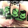 Green with black pattern and black-botton nail art