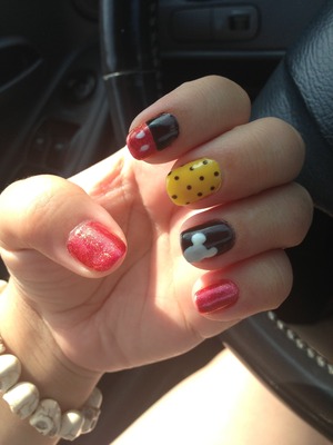 Disney inspired Mickey Mouse nails with polka dots and Mickey ears 