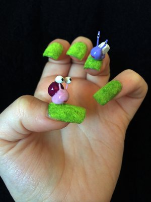 *Snails HandMade*

Products used:
•Rimmel nail varnish in 236 Green Grass.   •Green flocking powder.   •Rimmel finishing touch ultra shine top coat.   •Royal nail glue.