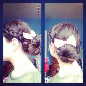 Love this easy look! Dutch braid swooping down, ending in a sock bun with a wrap around braid:) and a cute bow to top it off 