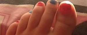 Painted toe nails pink and blue patterns 