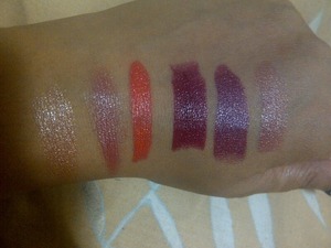 I was going through my make up drawer and found some oldies but goodies that I had completely forgotten about! Thought I'd share them with you.
From L-R the colours are: Loreal TX135 340 / Revlon Goldmist Broze / Yardley Coral Passion / Almay Wine / Avon Cranberry / Avon Nude Perfection.  Clearly I am a fan of cremesheen/shimmer lipsticks :-D