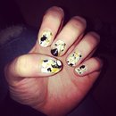 Gold and black splatter nails