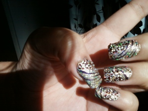 My New Yrs Eve nail!! It was extra glam and sparkly with glitter nail polish purple zebra stripes and white rhinestones:D 
