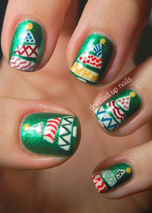 These were freehanded using a bunch of American Apparel colors on top of China Glaze Running in Circles, one of the prettiest colors I own!

http://www.dressedupnails.com/2012/12/the-digit-al-dozen-does-festiveness-day_11.html