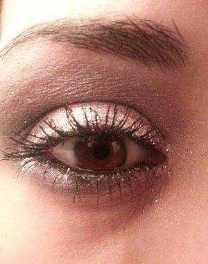 This doesn't really show up the best.  I used a silver shimmer color on my lids with a steel blueish gray on the outter parts of my eye and the crease.  I added a white shimmer shadow to highlight my eyes and then added some Lorac's silver liquid luster to line my top lid and part of my bottom lid. Lastly, I put a bit of the blueish gray under my eye and smoked it out a bit.  Let me know what you think!!