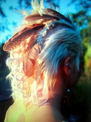 inspired by native american hairstyles I made this on my friend. Feathers from the chickenbreeder on my street.