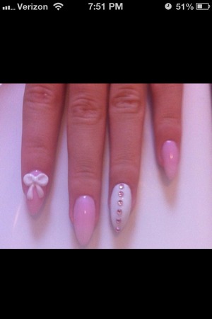 Tickle me pink and white nails with bow and rhinestones