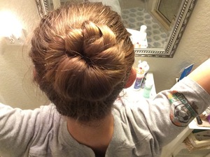 Make a medium/high ponytail. Take a small section of hair wrap it around the other hair. Add to the small section. Repeat this until your hair is fully wrapped. Once finished wrapping twist it around the original ponytail and bobby pin it in place.