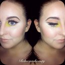 Wing liner with yellow pop of colour