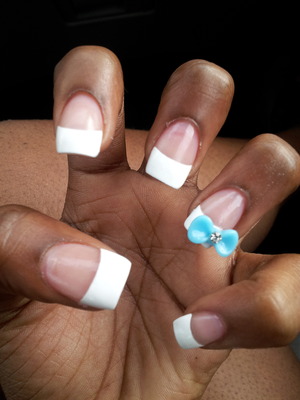 French Tip with a blue bow .