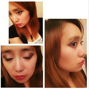Smokey cat eye done with shimmery cream, gunmetal, and muted purple eye shadows. Hot pink liner accents. Red lips.