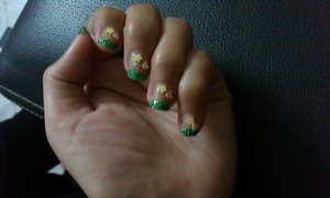 Glitter manicure nail.First you have to put glue on your fingertips and then put your finger in glitter box and after 10sec take out your ,you will see that glitter had stick on your fingertips. Then put topcoat and your done:)you can decorate your nails with sticker.