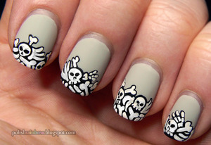 This was done for a Halloween nail art challenge! The bones were painted on using fluid acrylic paint and a tiny brush.

More on the blog post: http://polishrainbow.blogspot.com/2012/10/this-is-halloween-nail-art-challenge_28.html