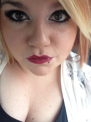 Did this look for hallowen at work. Just a black eye with orange rhinestones on the outer edge and a dark red lip. 