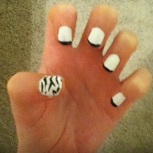 I did this by painting all of my nails white and then using a black striper, drew this design on all of my nails.