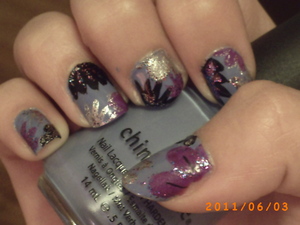 This was a design I did for my friend for her grade 8 graduation, which happened to be my grade 8 graduation as well. If I redid it today, it would be a lot nicer. But this was one of my best designs back in the day. 

For this design I used:
China Glaze- Secret Perri-Wink-Le 
L.A. Colours Art Deco- Purple 
L.A. Colours Art Deco- Silver Glitter 
L.A. Colours Art Deco- Blue and Purple Glitter 
Icing Nail Art- Silver 
Icing Nail Art- Black
Icing Nail Art- Multi-Coloured Glitter