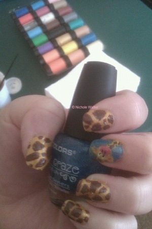 the giraffe and giraffe print are acrylic paint- see next pic for close up of my accent nail
