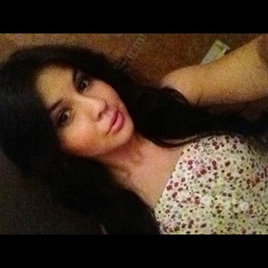Natural make up, curled hair and Floral Romper.