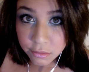 black liner, light black shadow on lid, white and grey highlight, silver eyeliner on waterline and as high light. light blush