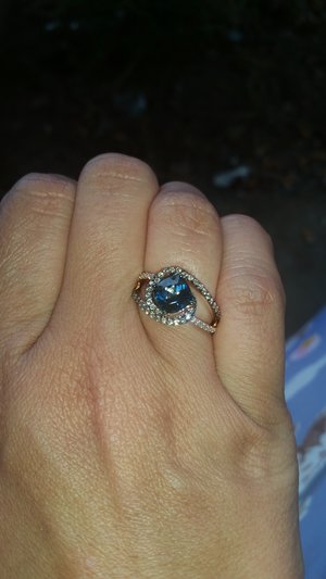 I got a new ring LeVian London Blue with white and chocolate diamonds is rose gold.....it's a Cinderella ring I love it. I had surgery and my honey suprised me with it today (: