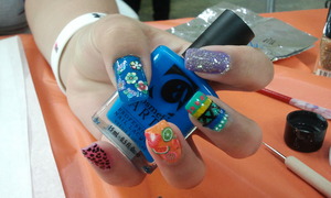 A different design on every nail. Flower fimo, glitter, tribal, fruit fimo, and leopard print.