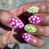 Pink & green nails with white dots & glitter.
