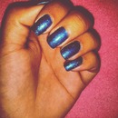 Glitter blue nails.