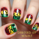 Freehand floral silhouettes over a rasta-color gradient