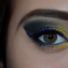 Yellow makeup with purple eyeliner