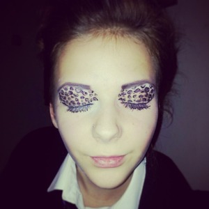 Purple leopard print eyes. Would look better with bigger eyelashes.