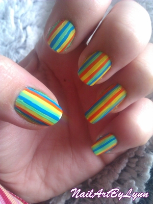 This is all acrylic paint. I made these stripes with a thin striping brush. for more designs, check my blog: http://nailartbylynn.tumblr.com/