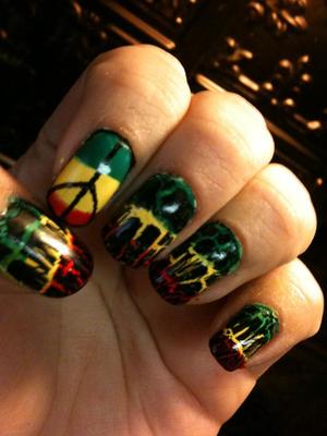 1. White base coat
2. Paint thick green, red and yellow lines (only one of the nails has to be perfect)
3. Crackle polish all but one nail 
4. Using a nail pen outline the nail in black then draw the branches for the peace sign
5. Top coat :)